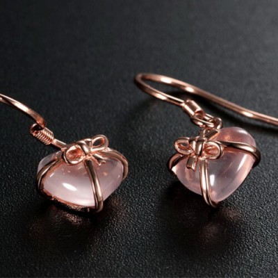 Pendientes de lazo de piedras preciosas en forma de corazón de color rosa brillante